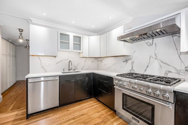 Interior, Kitchen, Marble Walls, Recessed Lighting, Stainless Steel Appliances, Wood Texture Flooring