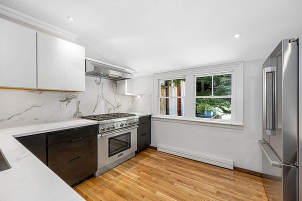 Interior, Kitchen, Marble Walls, Recessed Lighting, Stainless Steel Appliances, Wood Texture Flooring