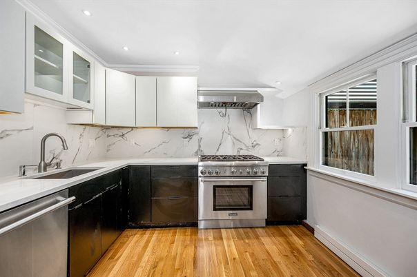 Interior, Kitchen, Marble Walls, Recessed Lighting, Stainless Steel Appliances, Wood Texture Flooring