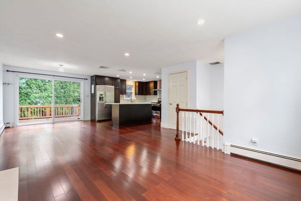Empty room, Interior, Kitchen, Recessed Lighting, Stainless Steel Appliances, Wood Texture Flooring