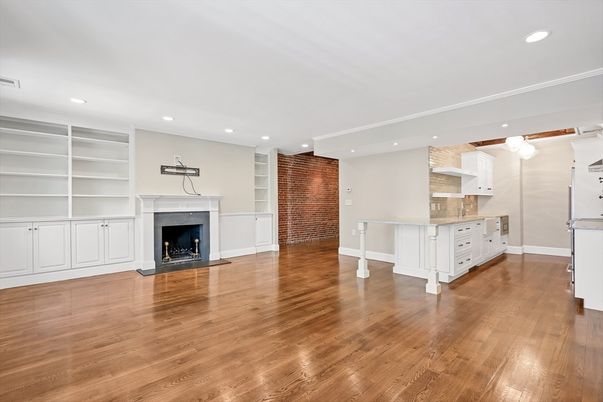 Empty room, Fireplace, Interior, Kitchen, Recessed Lighting, Stone Walls, Wood Texture Flooring