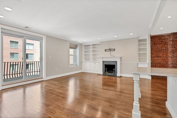 Empty room, Fireplace, Interior, Recessed Lighting, Stone Walls, Wood Texture Flooring