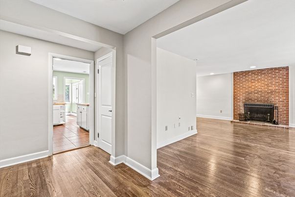 Empty room, Fireplace, Interior, Recessed Lighting, Stone Walls, Wood Texture Flooring