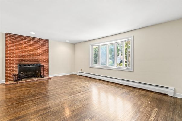 Empty room, Fireplace, Interior, Recessed Lighting, Stone Walls, Wood Texture Flooring