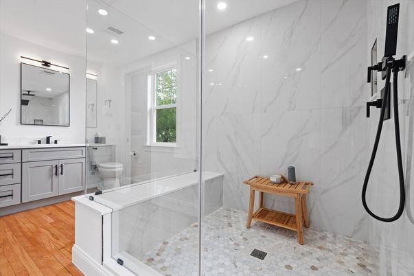 Bathroom, Glass Shower, Interior, Marble Walls, Recessed Lighting, Wood Texture Flooring