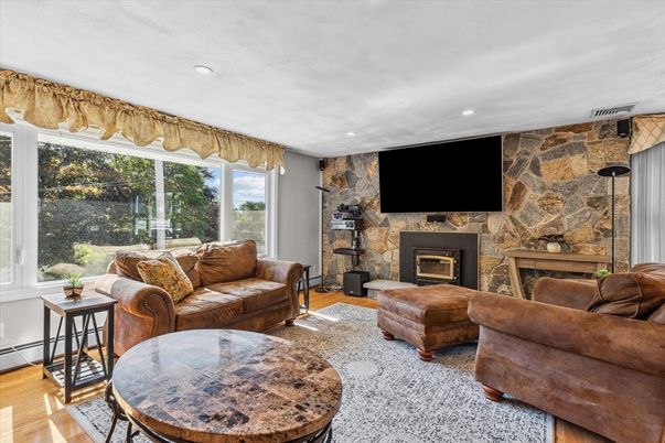 Fireplace, Interior, Living room, Recessed Lighting, Stone Walls, Wood Texture Flooring