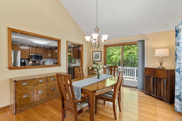 Chandelier, Dining room, Interior, Kitchen, Stainless Steel Appliances, Wood Texture Flooring