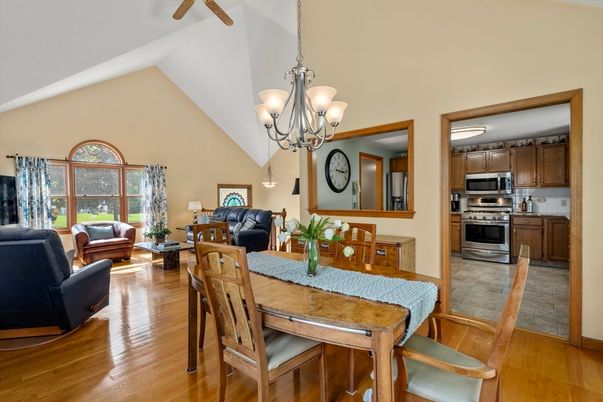 Chandelier, Dining room, Interior, Kitchen, Living room, Pendant Lights, Stainless Steel Appliances, Wood Texture Flooring