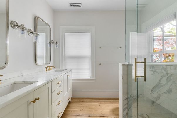 Bathroom, Dual Sink Vanities, Glass Shower, Interior, Marble Walls, Wood Texture Flooring