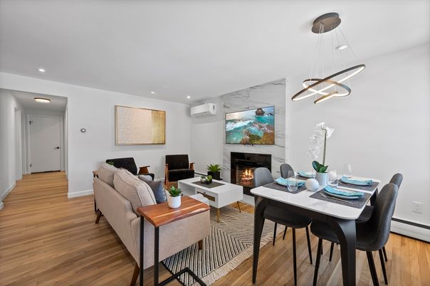 Dining room, Fireplace, Interior, Living room, Pendant Lights, Recessed Lighting, Wood Texture Flooring