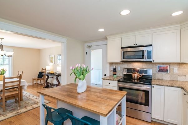 Chandelier, Dining room, Interior, Kitchen, Recessed Lighting, Stainless Steel Appliances, Wood Texture Flooring