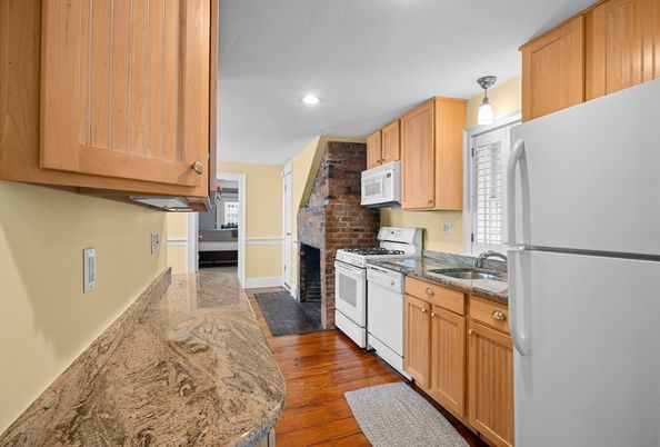Fireplace, Interior, Kitchen, Recessed Lighting, Stone Walls, Wood Texture Flooring