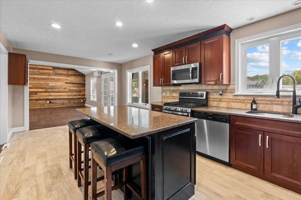 Interior, Kitchen, Recessed Lighting, Stainless Steel Appliances, Wood Texture Flooring, Wooden Walls