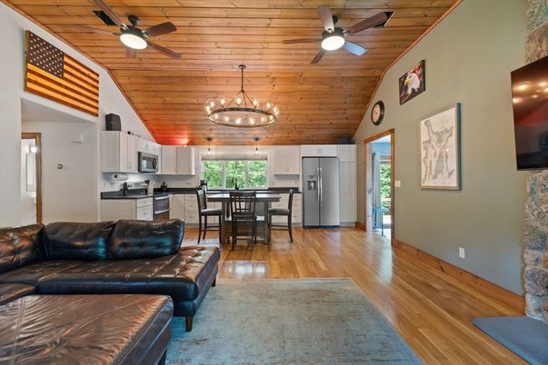 Chandelier, Dining room, Interior, Kitchen, Living room, Pendant Lights, Stainless Steel Appliances, Wooden Ceilings, Wood Texture Flooring