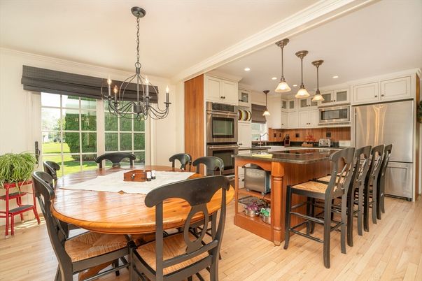Chandelier, Dining room, Interior, Kitchen, Pendant Lights, Recessed Lighting, Stainless Steel Appliances, Wood Texture Flooring