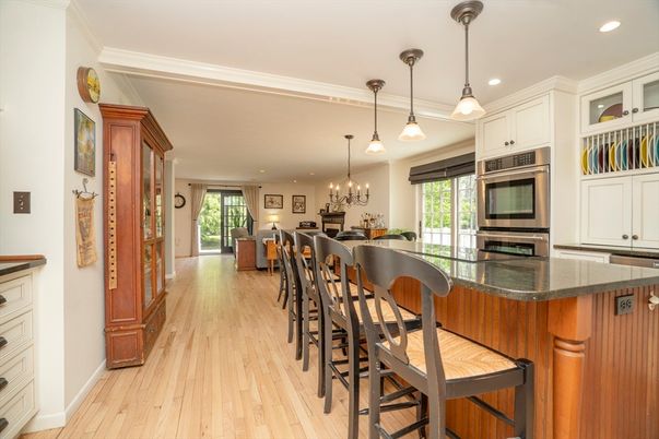 Chandelier, Dining room, Interior, Kitchen, Pendant Lights, Recessed Lighting, Stainless Steel Appliances, Wood Texture Flooring