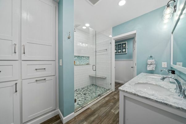 Bathroom, Dual Sink Vanities, Glass Shower, Interior, Recessed Lighting, Wood Texture Flooring