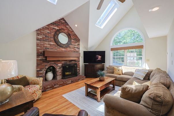 Fireplace, Interior, Living room, Recessed Lighting, Stone Walls, Wood Texture Flooring