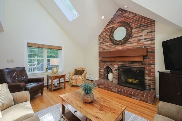 Fireplace, Interior, Living room, Recessed Lighting, Stone Walls, Wood Texture Flooring