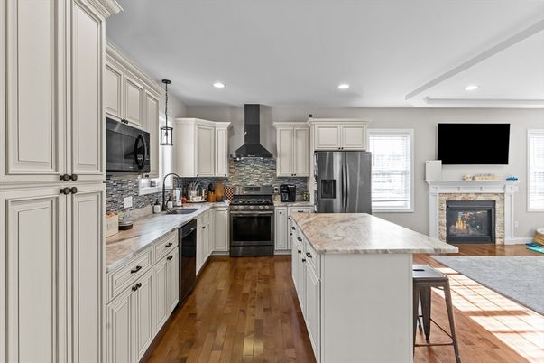 Fireplace, Interior, Kitchen, Pendant Lights, Recessed Lighting, Stainless Steel Appliances, Wood Texture Flooring