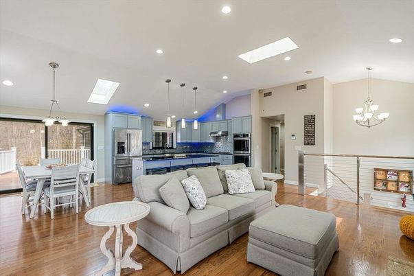 Chandelier, Dining room, Interior, Kitchen, Living room, Pendant Lights, Recessed Lighting, Stainless Steel Appliances, Wood Texture Flooring