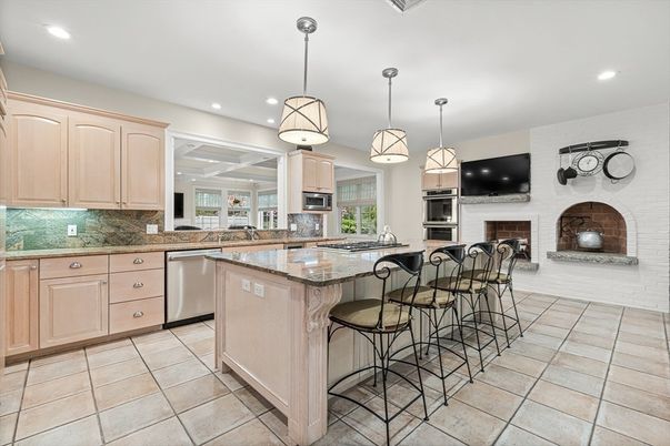 Fireplace, Interior, Kitchen, Pendant Lights, Recessed Lighting, Stainless Steel Appliances, Stone Walls