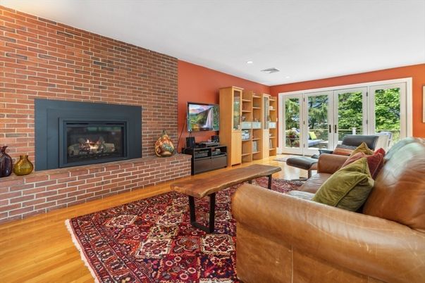 Fireplace, Interior, Living room, Recessed Lighting, Stone Walls, Wood Texture Flooring
