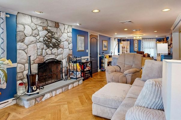 Fireplace, Interior, Living room, Recessed Lighting, Stone Walls, Wood Texture Flooring