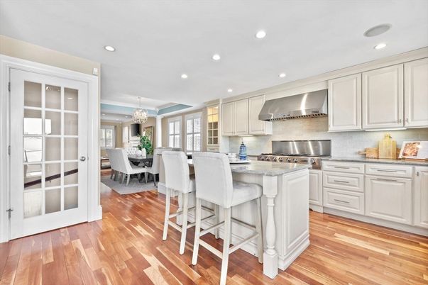 Chandelier, Dining room, Interior, Kitchen, Recessed Lighting, Stainless Steel Appliances, Wood Texture Flooring