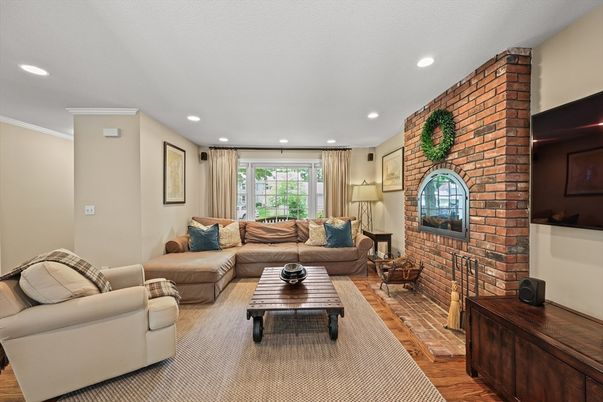 Fireplace, Interior, Living room, Recessed Lighting, Stone Walls, Wood Texture Flooring