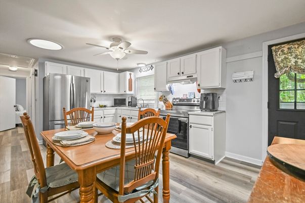 Dining room, Interior, Kitchen, Recessed Lighting, Stainless Steel Appliances, Wood Texture Flooring