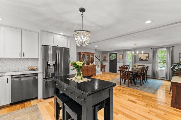 Chandelier, Dining room, Interior, Kitchen, Pendant Lights, Recessed Lighting, Stainless Steel Appliances, Wood Texture Flooring