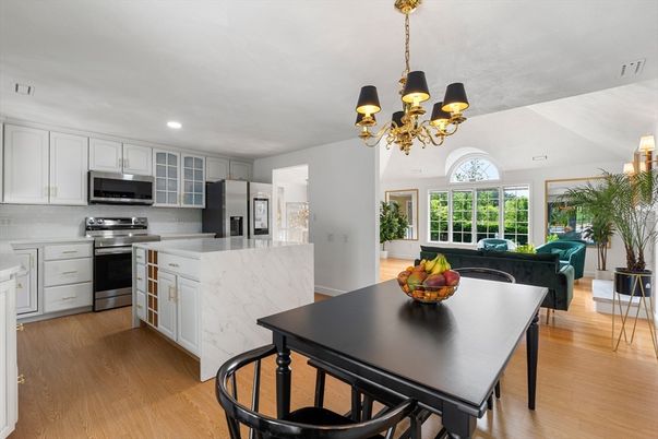 Chandelier, Dining room, Interior, Kitchen, Recessed Lighting, Stainless Steel Appliances, Wood Texture Flooring