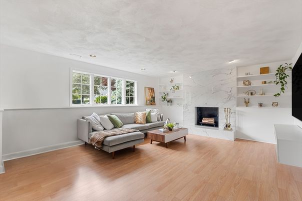 Fireplace, Interior, Living room, Marble Walls, Recessed Lighting, Wood Texture Flooring