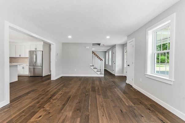 Empty room, Interior, Kitchen, Recessed Lighting, Stainless Steel Appliances, Wood Texture Flooring