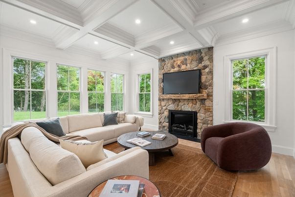 Fireplace, Interior, Living room, Recessed Lighting, Stone Walls, Wood Texture Flooring