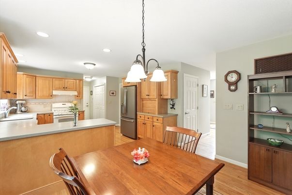 Dining room, Interior, Kitchen, Pendant Lights, Recessed Lighting, Stainless Steel Appliances, Wood Texture Flooring