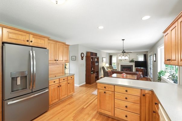 Dining room, Fireplace, Interior, Kitchen, Living room, Pendant Lights, Recessed Lighting, Stainless Steel Appliances, Wood Texture Flooring