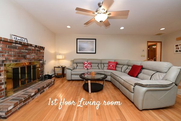 Fireplace, Interior, Living room, Recessed Lighting, Stone Walls, Wood Texture Flooring