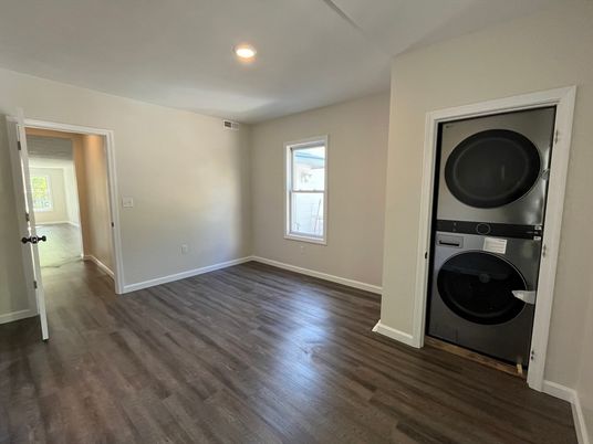 Empty room, Interior, Recessed Lighting, Utility Closets, Washer, Wood Texture Flooring