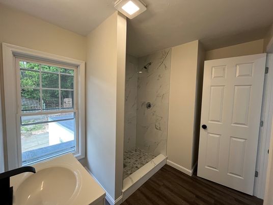 Bathroom, Glass Shower, Interior, Marble Walls, Wood Texture Flooring