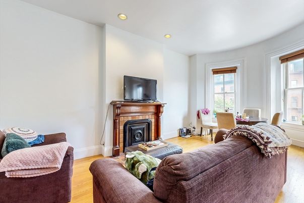 Dining room, Fireplace, Interior, Living room, Recessed Lighting, Wood Texture Flooring