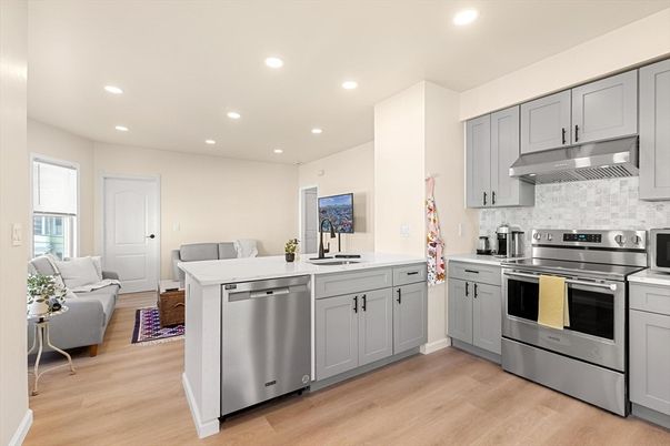 Dining room, Interior, Kitchen, Living room, Recessed Lighting, Stainless Steel Appliances, Wood Texture Flooring