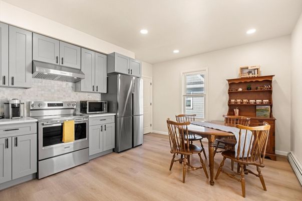 Dining room, Interior, Kitchen, Recessed Lighting, Stainless Steel Appliances, Wood Texture Flooring
