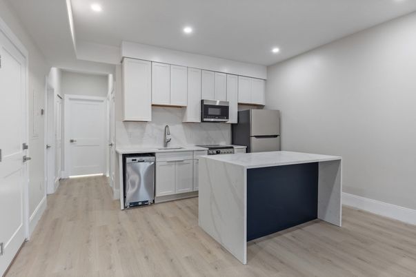 Interior, Kitchen, Marble Walls, Recessed Lighting, Stainless Steel Appliances, Wood Texture Flooring