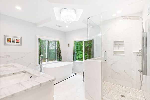 Bathroom, Chandelier, Dual Sink Vanities, Free Standing Baths, Glass Shower, Interior, Marble, Marble Walls, Recessed Lighting