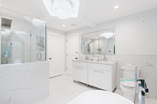 Bathroom, Chandelier, Dual Sink Vanities, Glass Shower, Interior, Marble, Marble Walls, Recessed Lighting