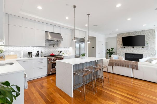Fireplace, Interior, Kitchen, Living room, Pendant Lights, Recessed Lighting, Stainless Steel Appliances, Stone Walls, Wood Texture Flooring