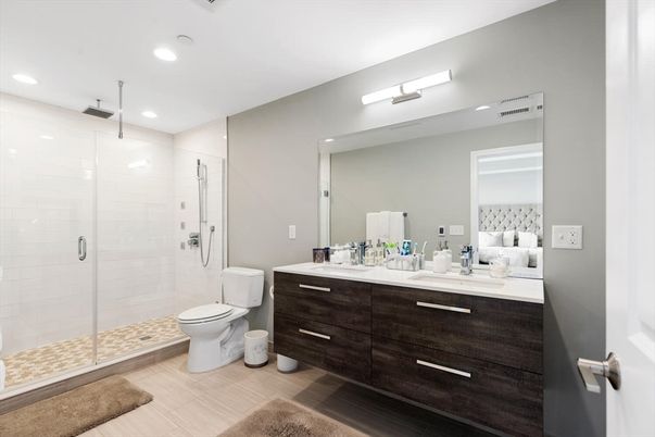 Bathroom, Bedroom, Dual Sink Vanities, Glass Shower, Interior, Recessed Lighting, Wood Texture Flooring