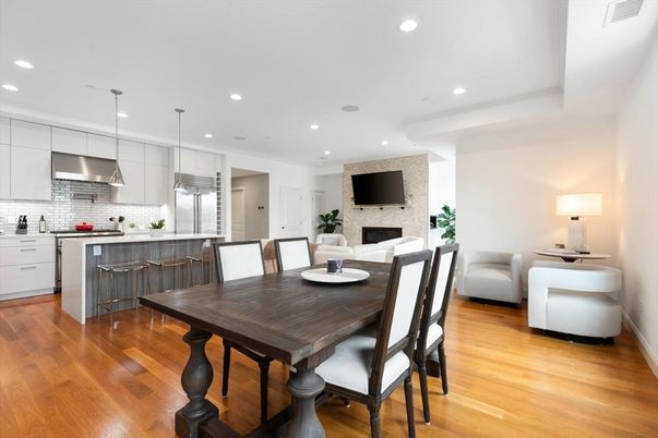 Dining room, Fireplace, Interior, Kitchen, Pendant Lights, Recessed Lighting, Stainless Steel Appliances, Stone Walls, Wood Texture Flooring